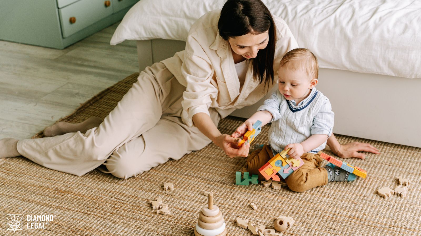 A mother playing blocks with her toddler on a carpet.