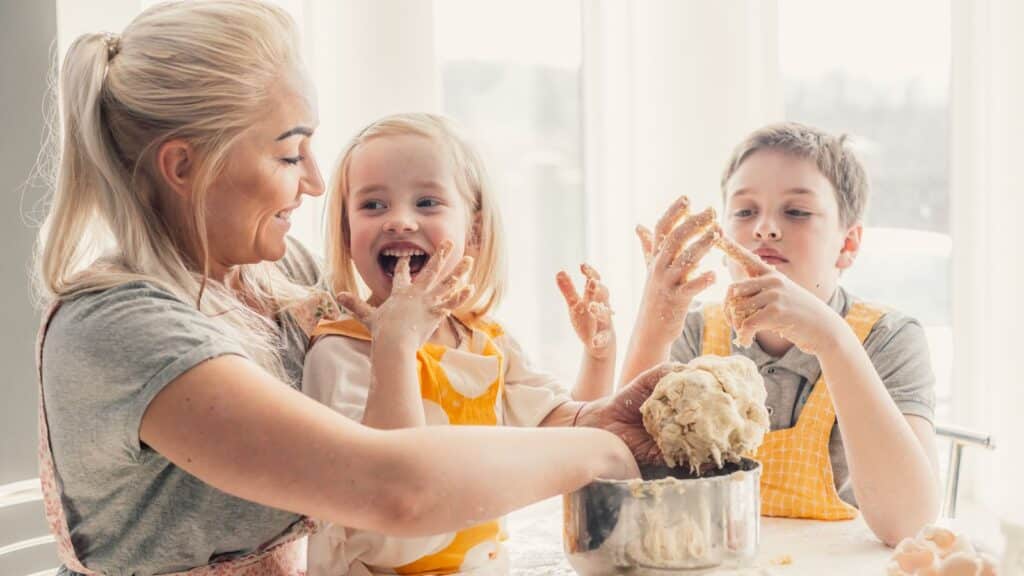 A mother baking with her children.