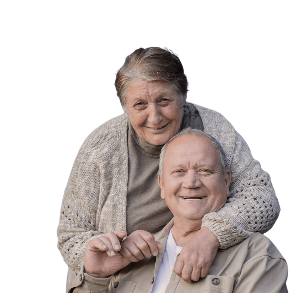 An elderly couple posing for a picture.